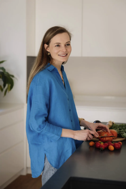 Stephanie preparing fresh vegetables in her kitchen